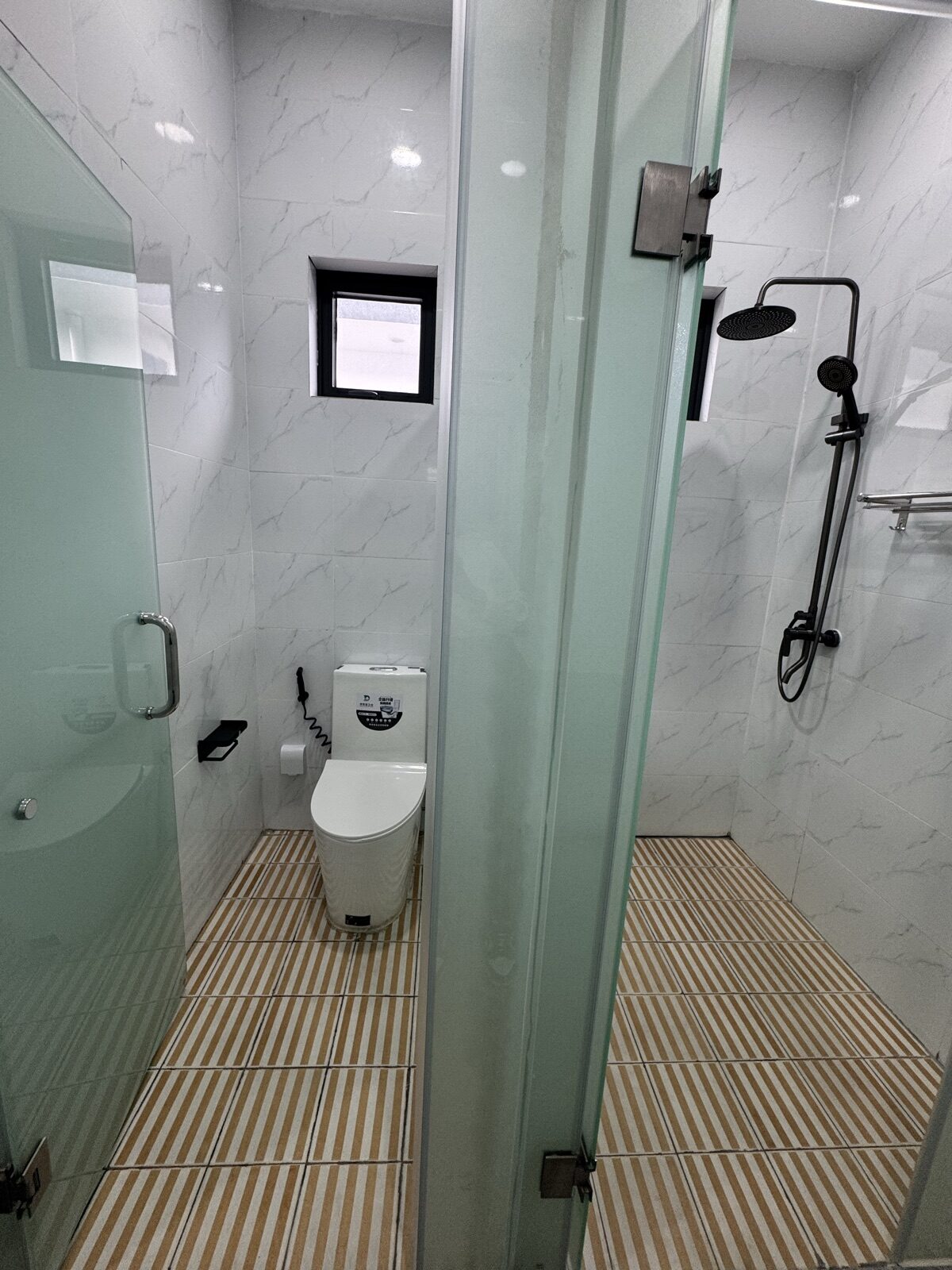 Single room private bathroom with separate shower